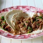 Easy slow cooker beef barbacoa can be used for tacos, enchiladas, tortas, and many other dishes. from RestlessChipotle.com