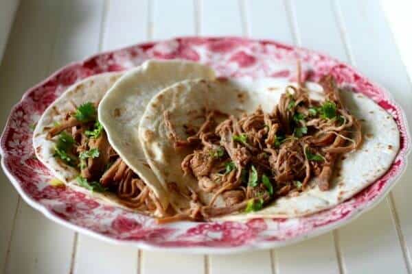 Easy slow cooker beef barbacoa can be used for tacos, enchiladas, tortas, and many other dishes. from RestlessChipotle.com