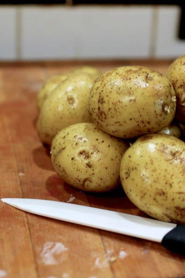 Raw potatoes are washed and ready to slice.