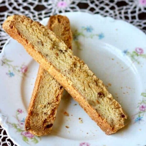 Overhead view of two biscotti on a plate.