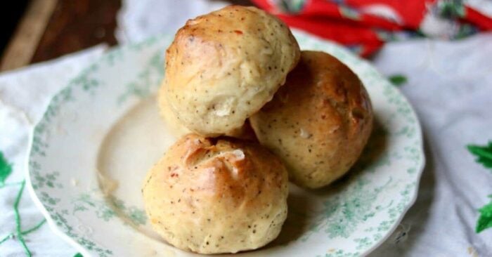 Easy cheese dinner rolls recipe are SO good! These yeast rolls are full of Cheddar and black pepper so they stand up well to highly flavored stews and soups. Great with salads, too! From RestlessChipotle.com