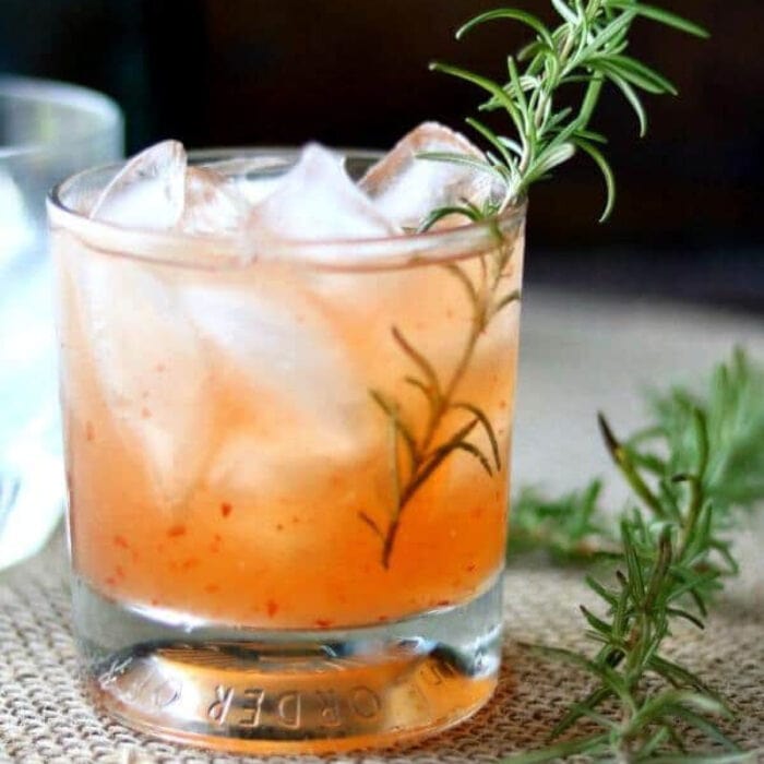 Closeup of a peach margarita in a glass.