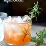A view of the spicy peach margarita with title text for Pinterest.