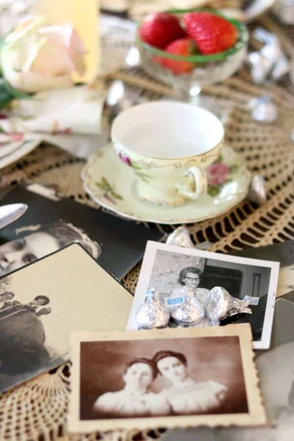 Vintage pictures of the author's mother and other moms on a table.