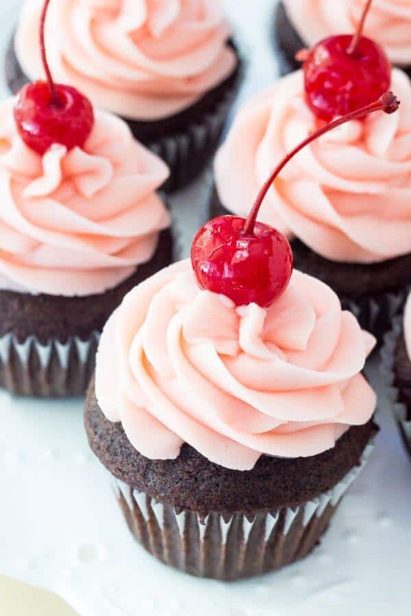 Rich and indulgent, these chocolate cherry cupcakes start with moist chocolate cupcakes. Then they're topped with maraschino frosting. Like a chocolate covered cherry in cupcake form!