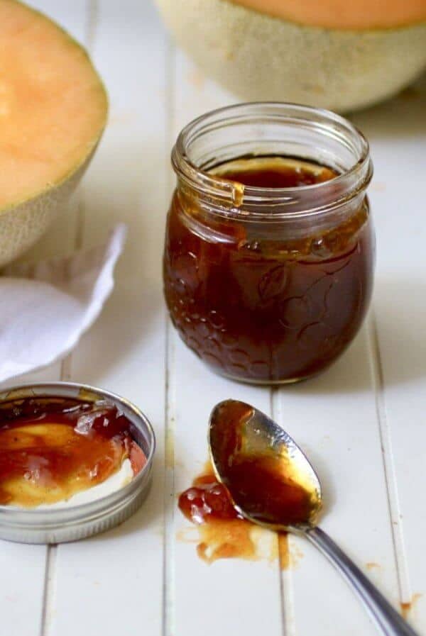 A view of cantaloupe jelly on a spoon.