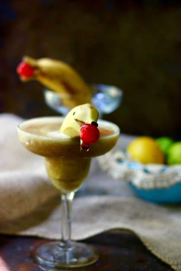 A closeup view of the banana daiquiri with the dolphin garnish.