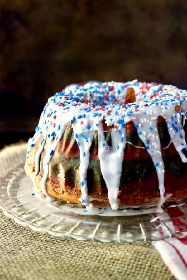 Perfect for summer holidays, this tangy red white & blue bundt cake is sweet and delicious with a tunnel of cheesecake filling right through the center. You'll love it! From RestlessChipotle.com