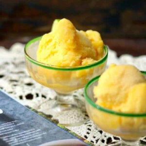 Two servings of ginger peach sorbet in sherbet glasses.