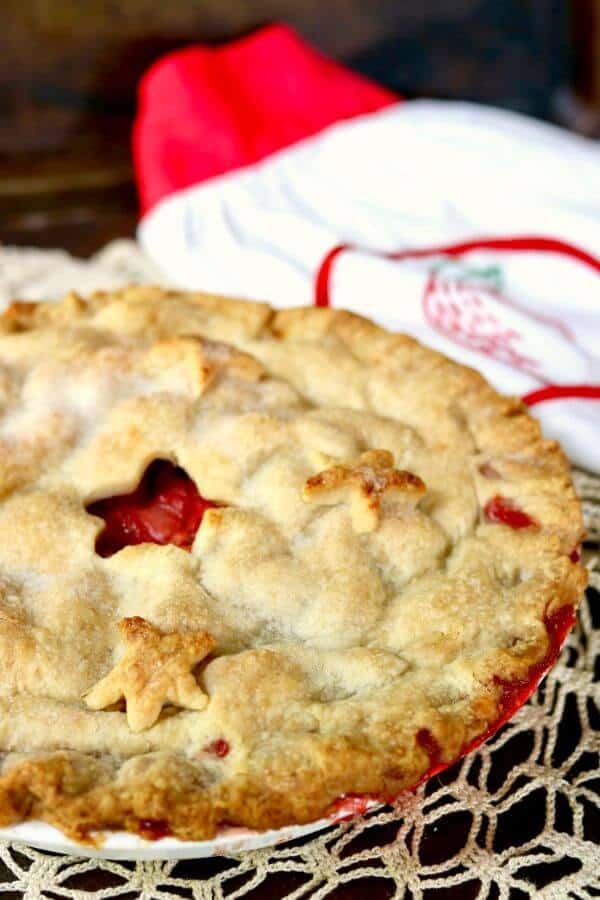 Just like Grandma's! Old fashioned strawberry rhubarb pie recipe is a perfect combination of sweet and tangy with a gorgeous bright crimson filling surrounded by buttery pastry. From RestlessChipotle.com