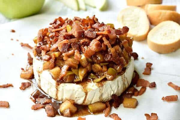 Baked brie with apples and bacon has a sweet, but salted caramel twist. From RestlessChipotle.com