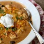 Creamy chicken enchilada soup recipe is ready in minutes! From RestlessChipotle.com
