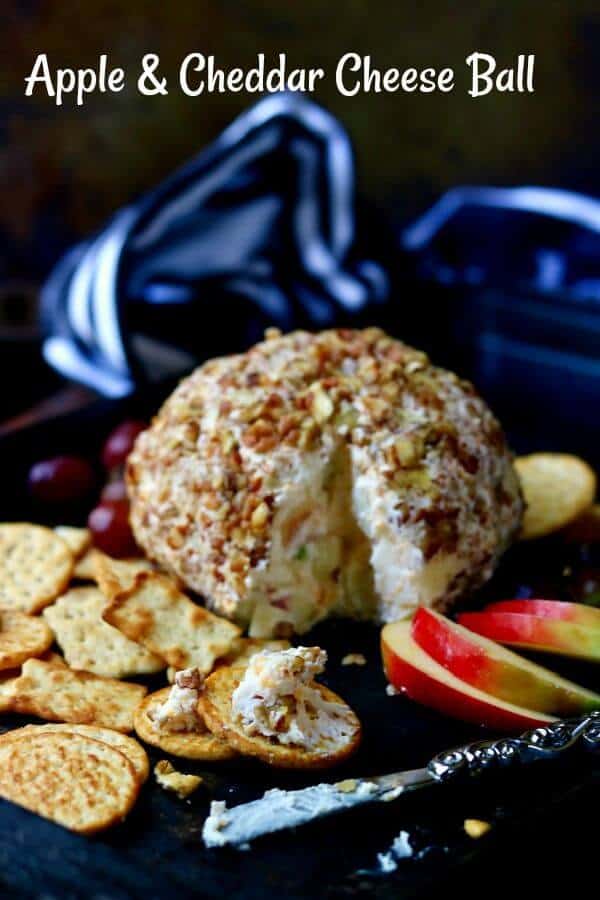 Easy apple cheddar cheese ball appetizer has a cracker spread with the cheese next to it. Title image.