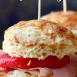 Closeup of ham sliders with text overlay for Pinterest.