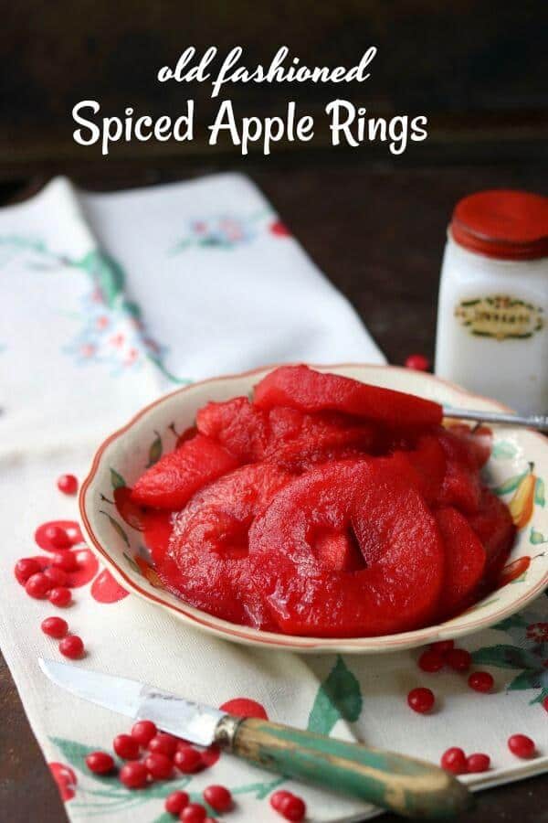 Bright red spiced apple rings made with Red Hots candy. Title text overlay.