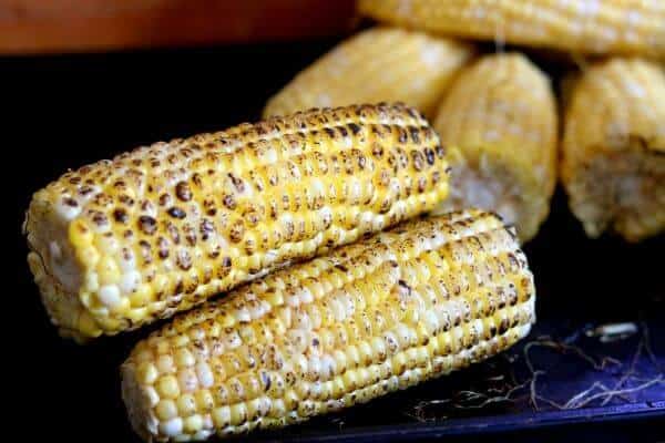 Fire roasted corn is bright yellow with blackened areas on the kernels
