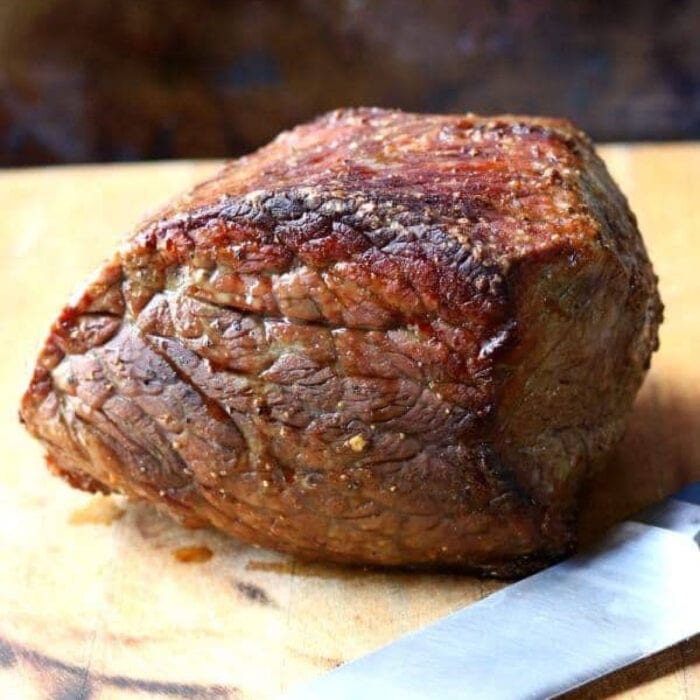 Beautifully browned beef roast waiting to be carved.