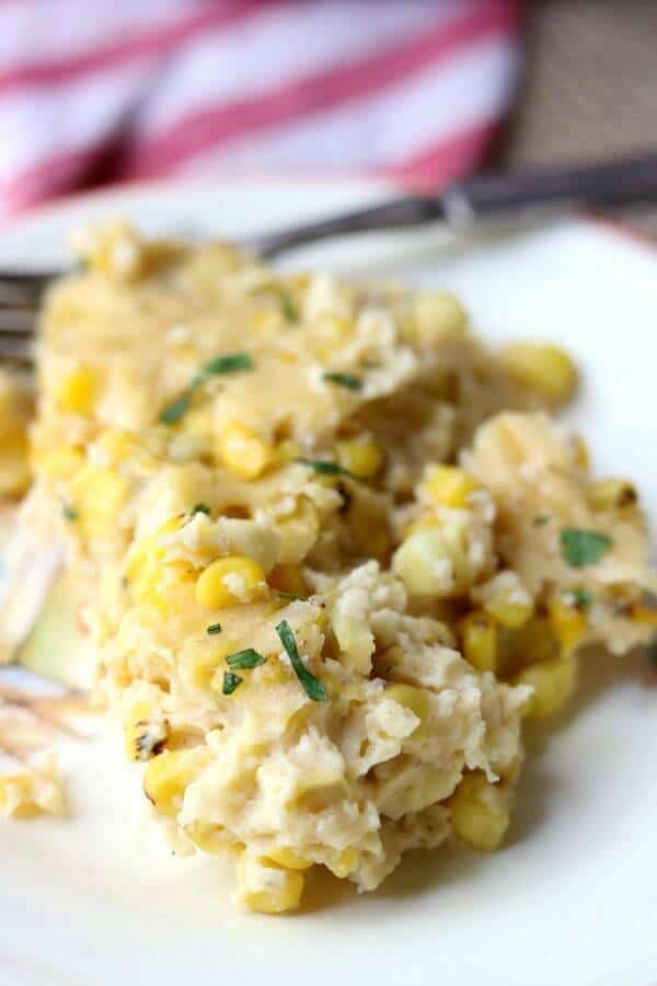 Closeup image of southern corn pudding sprinkled with finely chopped cilantro