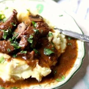 Tender beef tips in gravy over mashed potatoes - the finished recipe