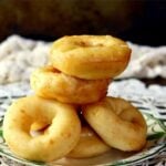 homemade donuts made from this homemade donut recipe stacked on a art deco plate. Recipe image from homemade donut recipe