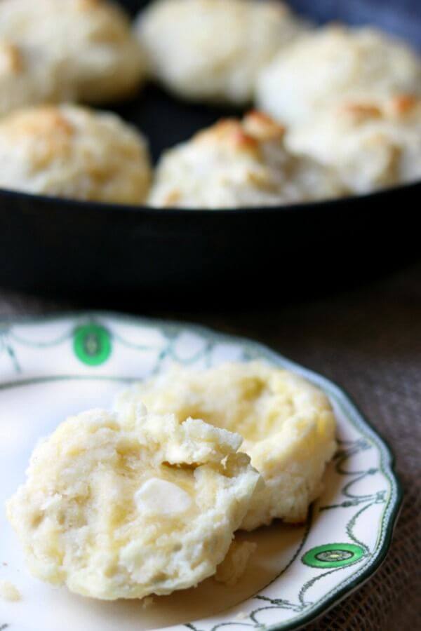 Drop biscuits sliced open with melting butter on the halves. 