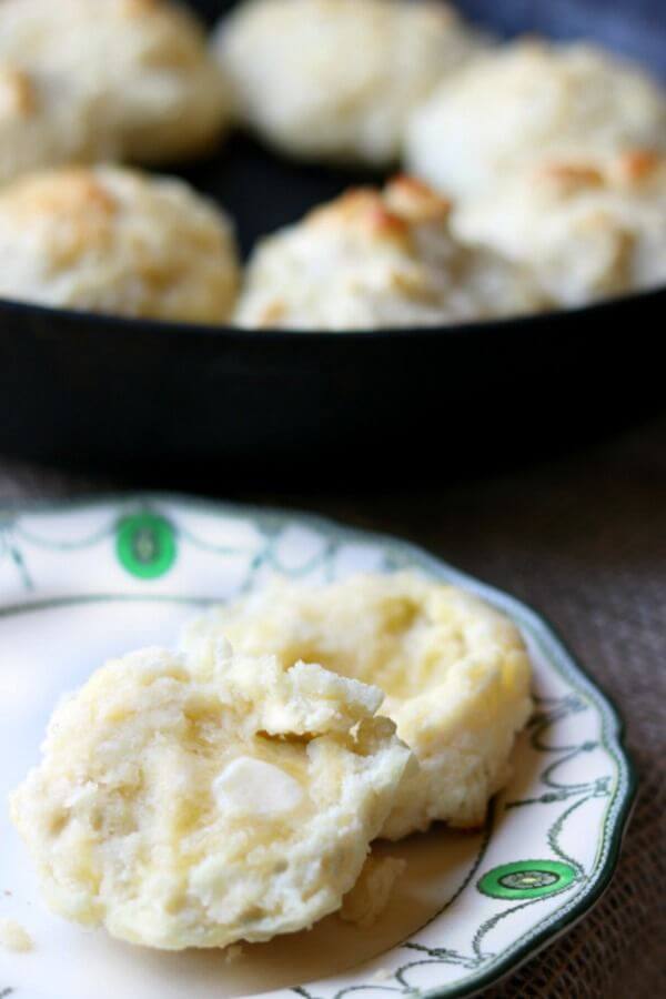 Drop biscuits sliced open with melting butter on the halves.