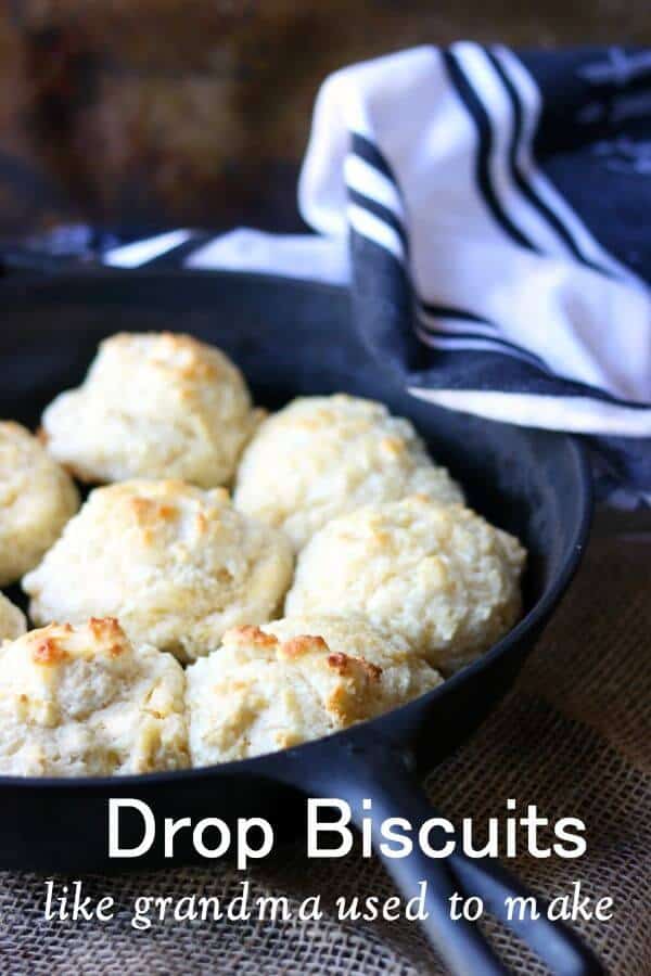 Golden brown drop biscuits in an iron skillet - title image