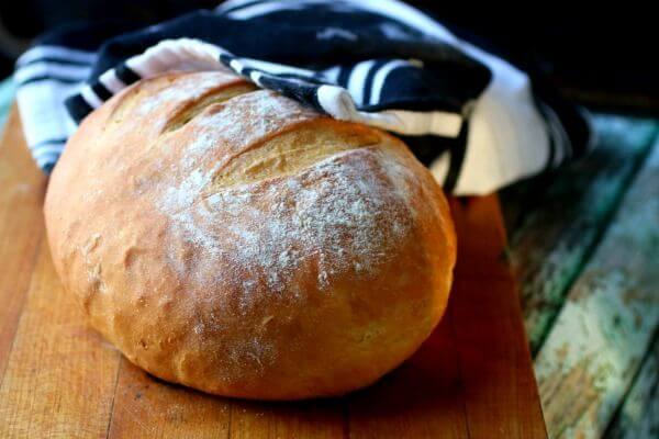 A close up image of artisan bread with a crispy crust 