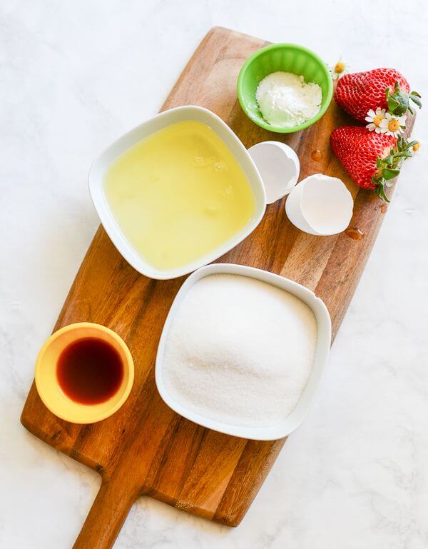 Ingredients for the meringue shell for the Pavlova recipe are arranged on a board.