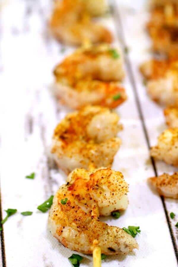 Closeup view of skewered Shrimp Creole on a table -ready to eat