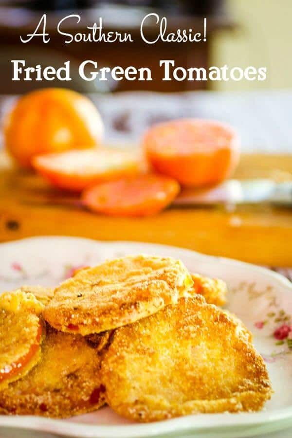 Fried green tomatoes recipe -title -fried green tomatoes on a platter with sliced tomatoes in the background.