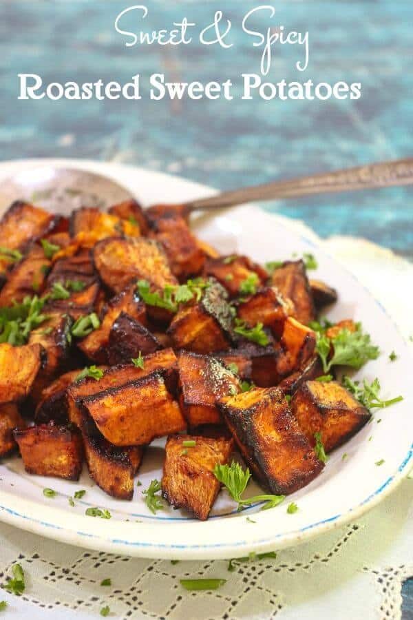 A platter of bright roasted sweet potatoes garnished with parsley. Title image