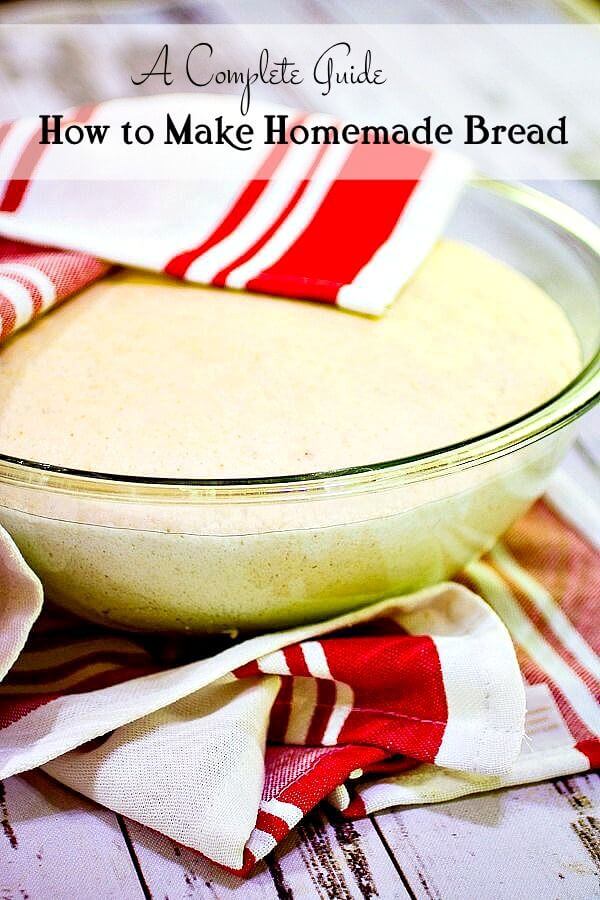 A bowl of bread dough with a white and red tea towel