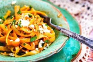 a fork in a dish of fettuccine with pumpkin Alfredo