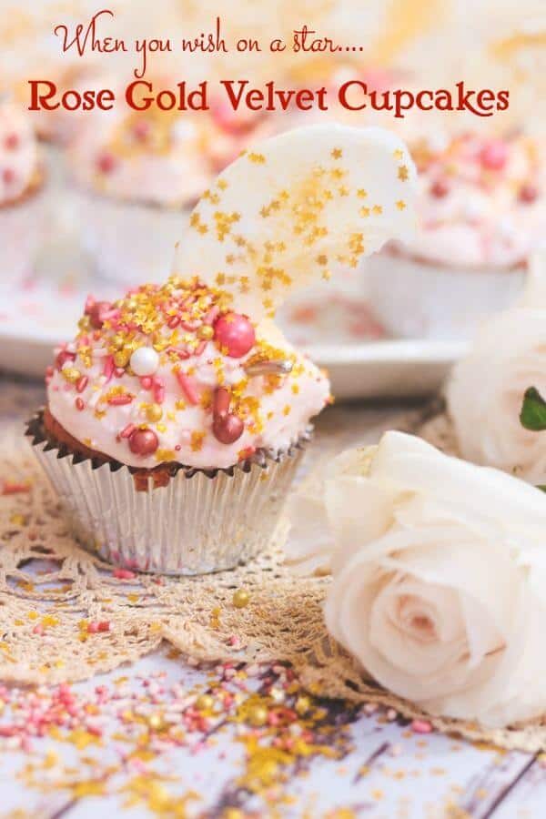 A cupcake placed in front of a tray of cupcakes with a pink, dreamy look.