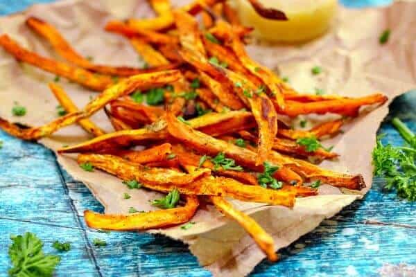 Sweet potato fries on a brown newspaper - feature image