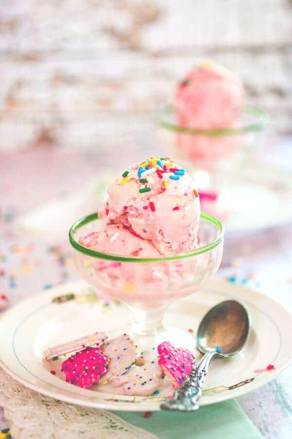 Pink Circus Animals Cookies Ice Cream in a vintage glass dish with sprinkles on top