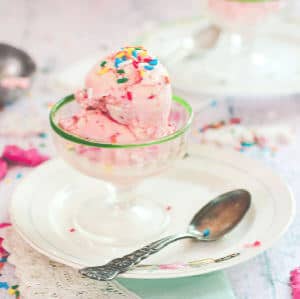 Pink ice cream made from frosted animal crackers in a ice cream glass.