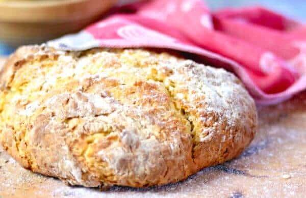 A round loaf of Irish soda bread with a golden crust.