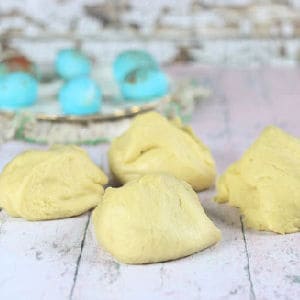 Pieces of raw dough resting on a table.