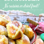 Hot cross buns surrounded by Easter eggs with text overlay for Pinterest.