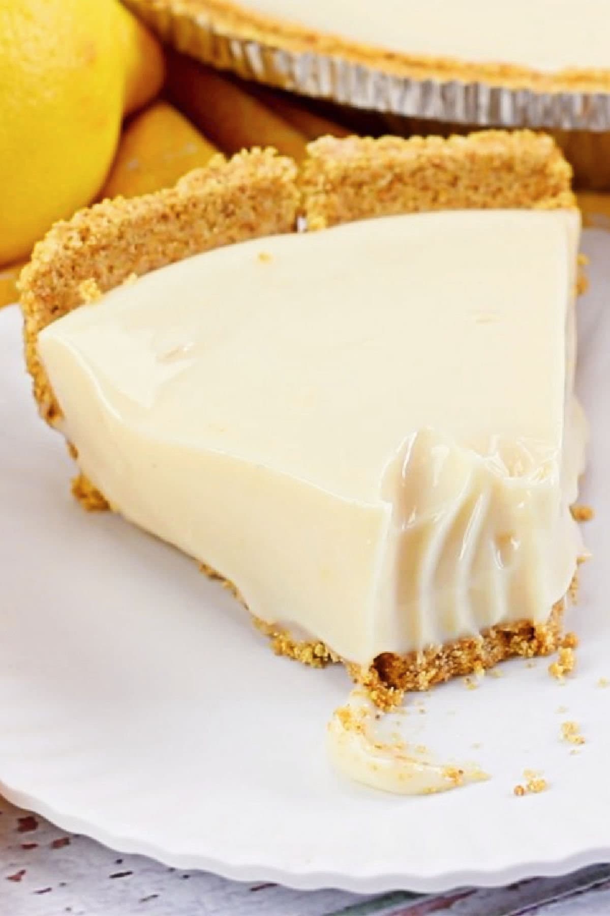 A slice of lemon pie in a graham cracker crust.