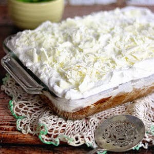 The finished tres leches cake in a pan.