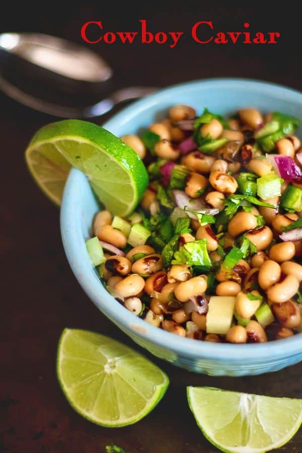 Black eyed peas salad with lime in a blue bowl - title image