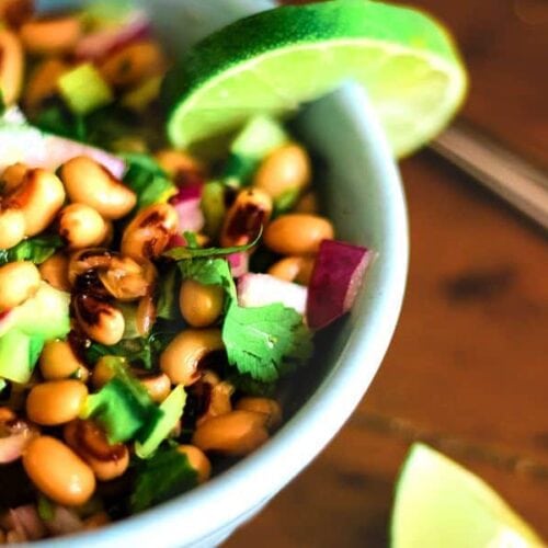 Extreme close up shows the ingredients within the black eyed pea salad.