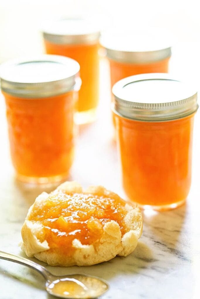 Homemade Jam on biscuit on white platter