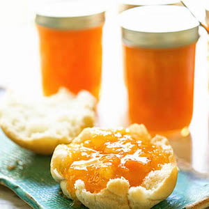 Apricot Jam on biscuit on blue plate