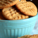 Peanut butter cookies in blue bowl with text overlay for Pinterest.