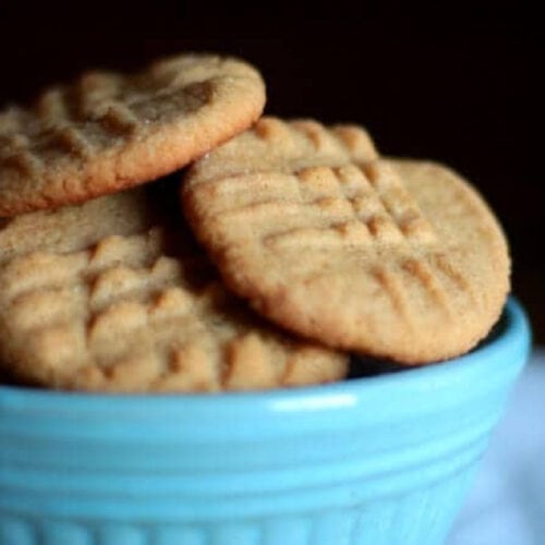 Peanut butter cookies in a bowl showing texture of the cookies.
