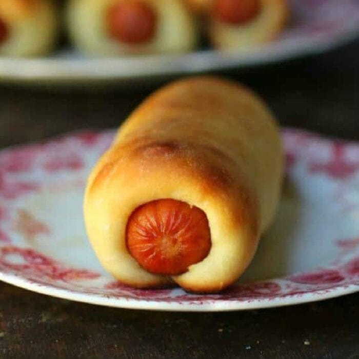 Closeup of sausage kolache on a plate.